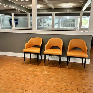 three chairs in a waiting area