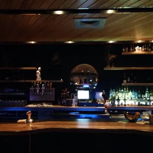 bar counter with bottles of alcohol