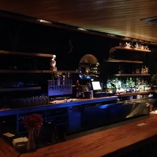 a bar with a laptop on the counter