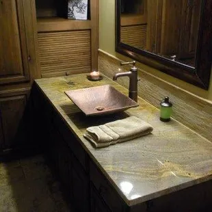 a bathroom with a sink and cabinets