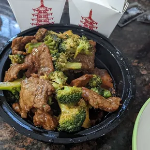 Beef and broccoli to go (with one bite removed)