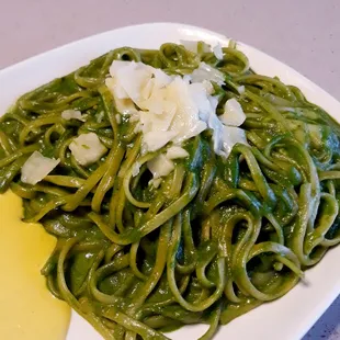 a plate of green pasta