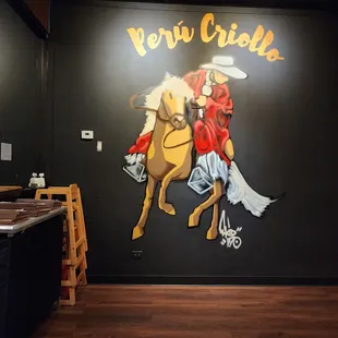 a mural of a cowboy on a horse