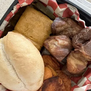 Lurin Breakfast with tamal, sweet potatoes, french bread and chicharron.