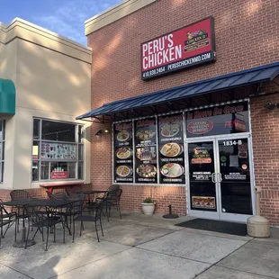 Front of the store, very limited outdoor seating, but there are tables inside. Also free parking here.