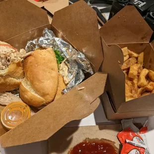 Chicken sandwich and a side of french fries.