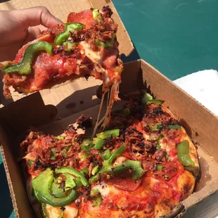 Personal pizza (7 inch) with three toppings loaded on!