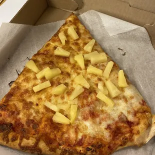 Pineapple pizza slice