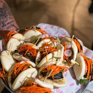 a person holding a plate of food