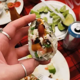 Chilled oyster topped with ceviche, lime, ketchup, salt, tapatio and SALSA NEGRA!!