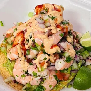 a shrimp salad in a styrofoam container