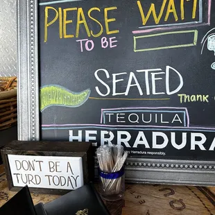 Please wait to be seated - Don&apos;t be a turd today.
