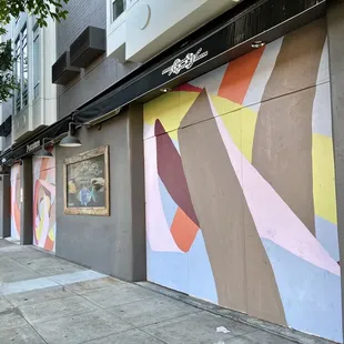 a colorful mural on the side of a building