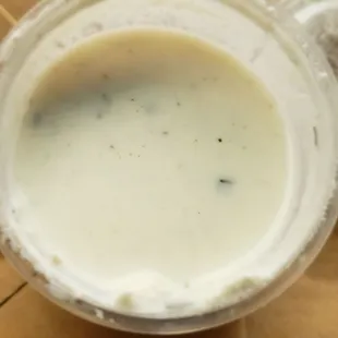 a close up of a cup of milk