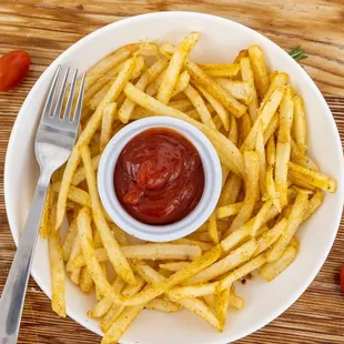 a plate of french fries with ketchup
