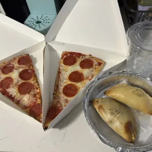 Pepperoni pizza slices, spicy beef and sausage empanadas