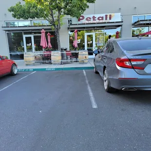 a car parked in front of a restaurant
