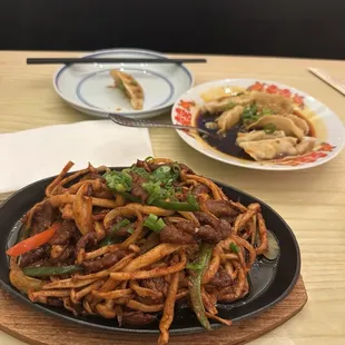 Sizzling beef with vegetables and the spicy dumplings (chicken). Yummy!!