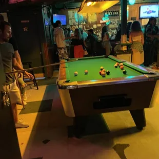 a pool table in a bar