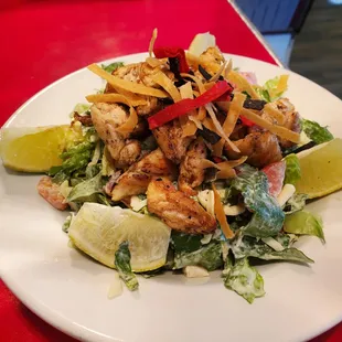 a white plate with a salad on it