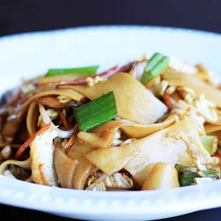 a plate of stir fried noodles