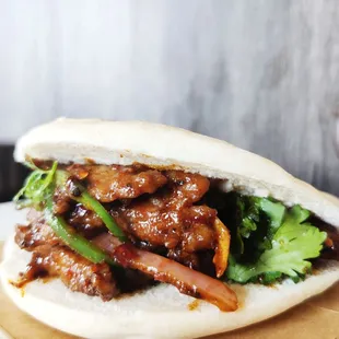 a pork and broccoli sandwich