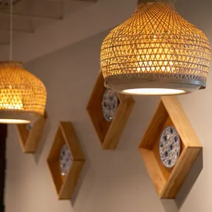 a row of lamps hanging on a wall