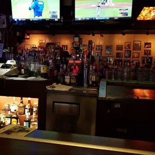 a baseball game being played on tvs