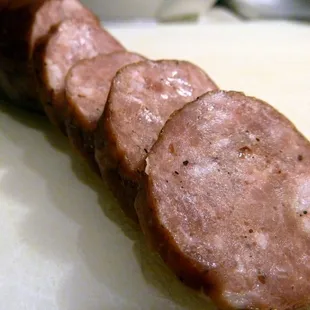 a sausage on a cutting board