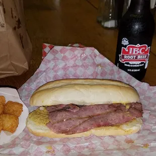 Polish sausage is sliced thin &amp; served on a hoagie roll