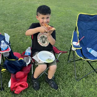 Enjoying the OTP pizza at the school movie event