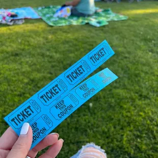 My tickets for complementary pizza and snowcones thanks to the sponsors at the school