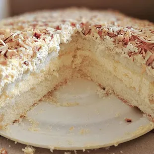 layers of chiffon and custard filling covered in icing and burnt almonds