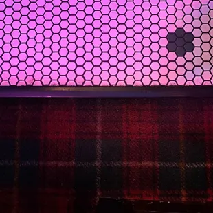 Amazing flooring - plaid carpet and penny tile