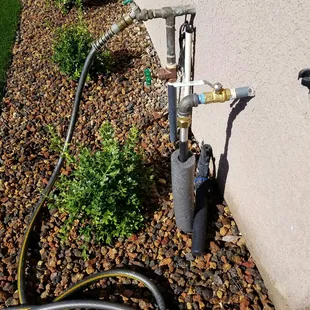 Extended natural gas line under patio (with soft hose, through pipework so maintenance possible in future if necessary).