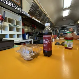 a bottle of soda on a counter