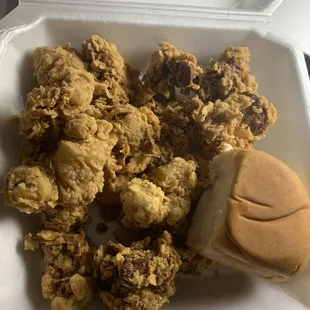 Fried gizzards with gravy and a biscuit.