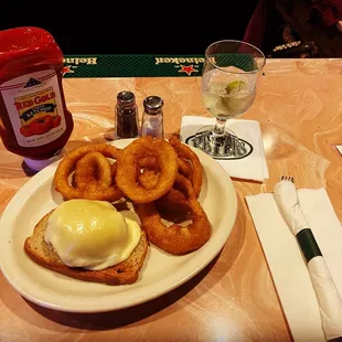 a plate of onion rings and an egg