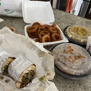 a sandwich and onion rings