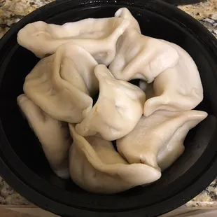 Steamed dumplings, very large and full of meat but fried is probably the way to go.