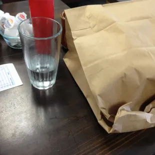 The waitress boxed my food for me in front of me at the table then brought this and bagged it up.