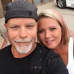 a man and a woman taking a selfie