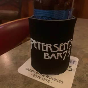 a bottle of beer on a coaster