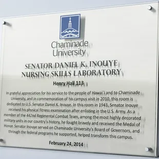 Plaque, stainless steel box, plexiglass, digital print and vinyl lettering