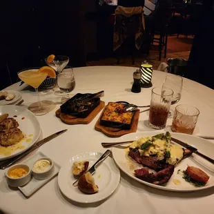 a table full of food and drinks