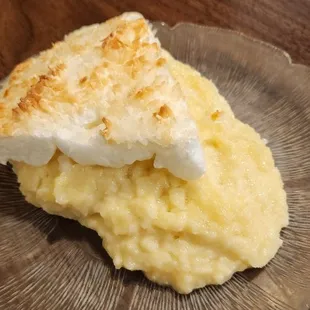 Coconut cream pie. Warming it up caused it to collapse &amp; spread out some.