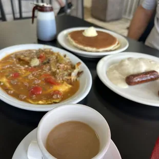 Spanish omelet with a side of b&amp;g. Short stack of pancakes.