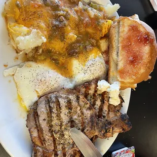 Two pork chop and egg breakfast.