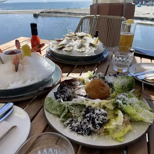 Caesar salad with Tempura crab cake, shrimp cocktail, dozen oysters with a home made hot sauce