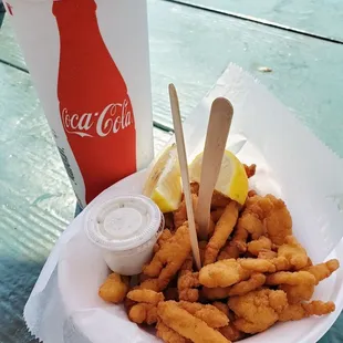 a plate of fried fish and fries
